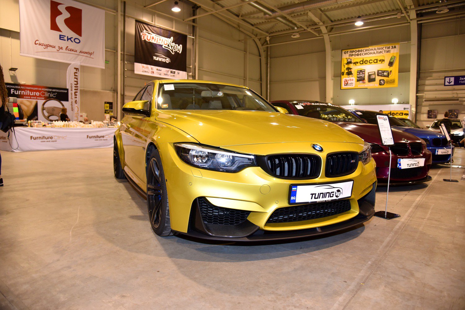 Yellow BMW M3 F80 with aggressive front splitter and sporty grille