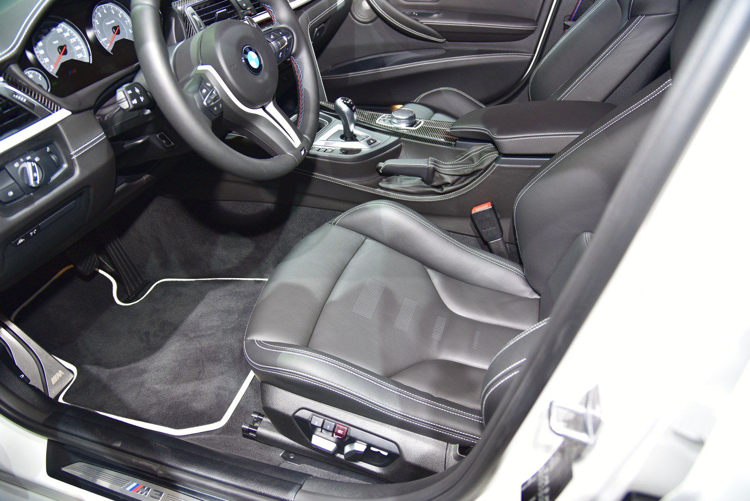 Sport seats, modern dashboard, and central console with leather upholstery