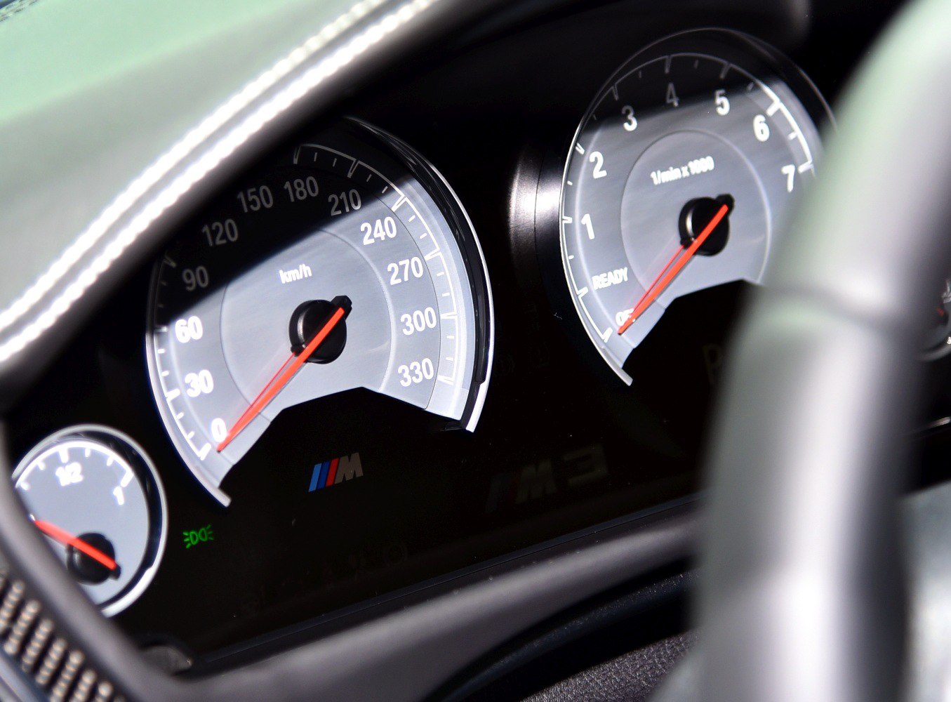Close-up of instrument cluster with speedometer and tachometer gauges