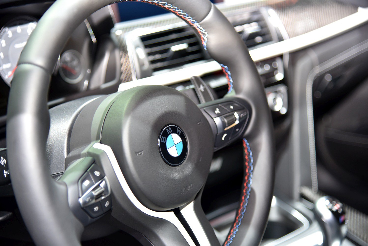 BMW M3 F80 steering wheel with multi-function buttons and dashboard elements