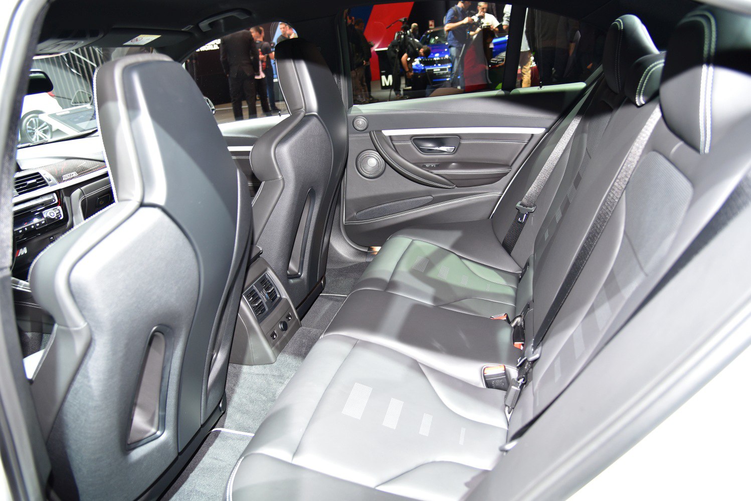 Luxury rear seating with premium leather upholstery and detailed interior design.