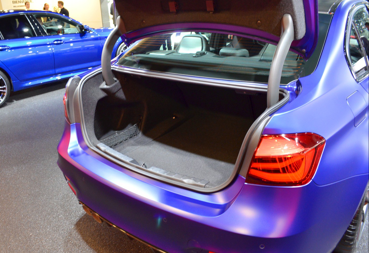 Open trunk space with visible rear seats and taillight.