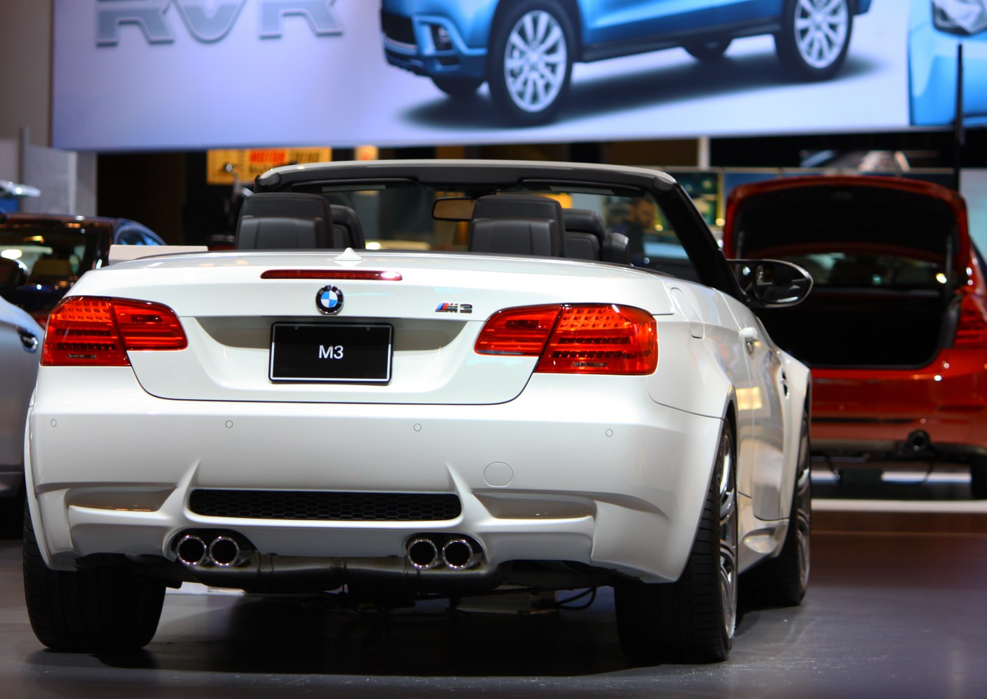 Rear view of convertible with quad exhaust and sporty taillights