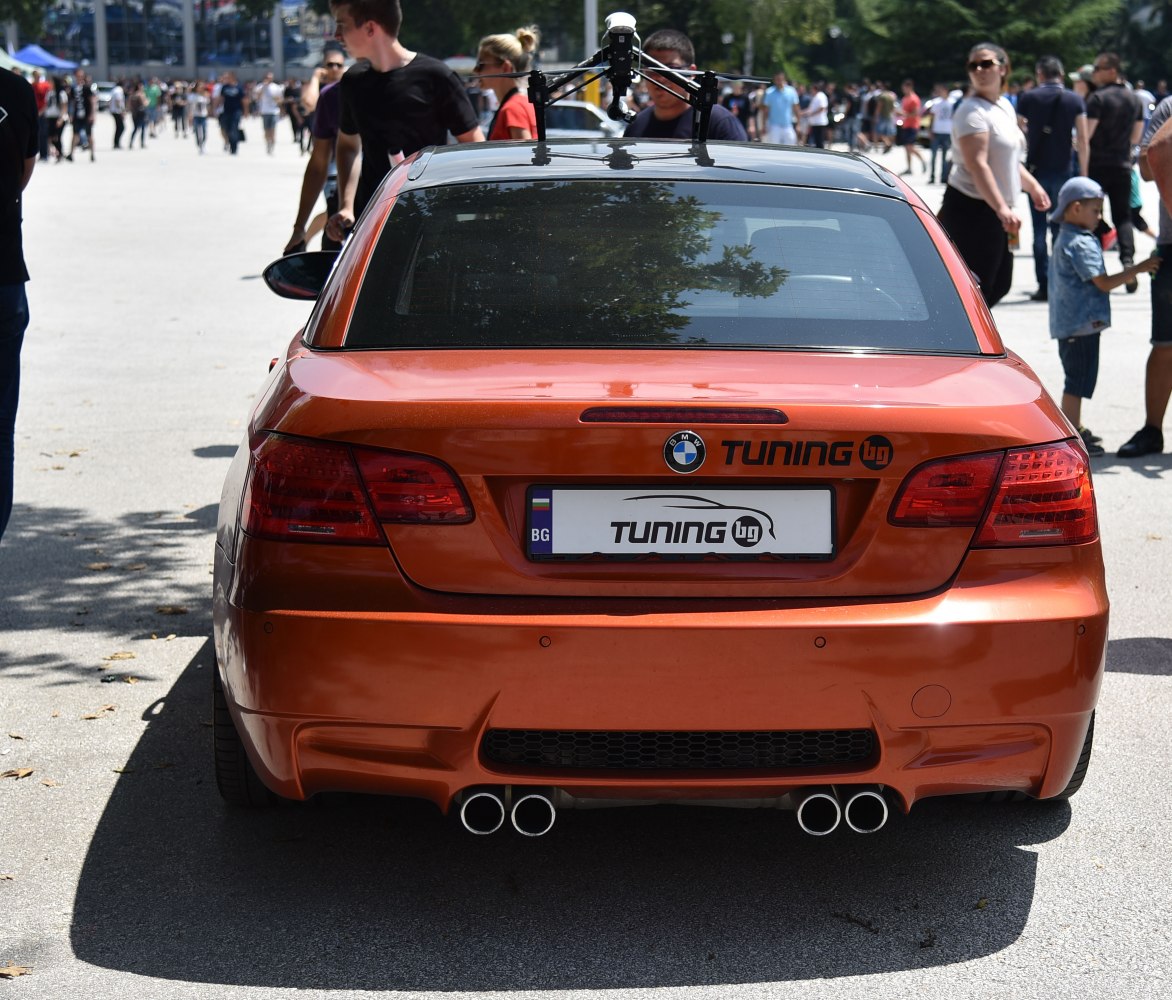 Orange convertible rear with quad exhausts and tinted window