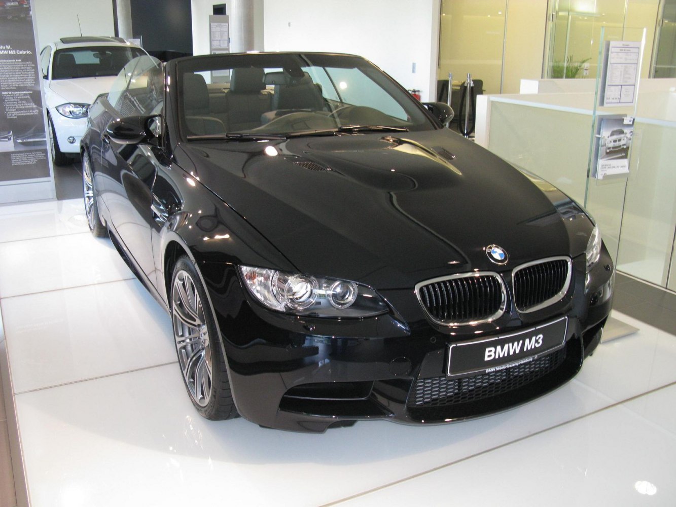 Front view of black convertible with distinct BMW kidney grille and headlights