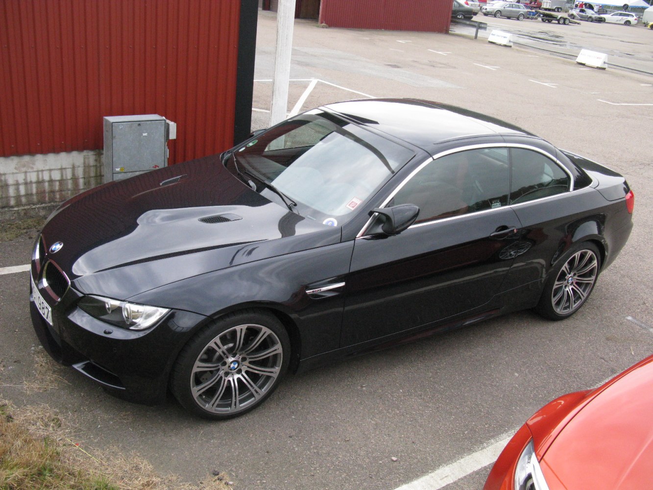 Black coupe with ventilated hood and sporty alloy wheels