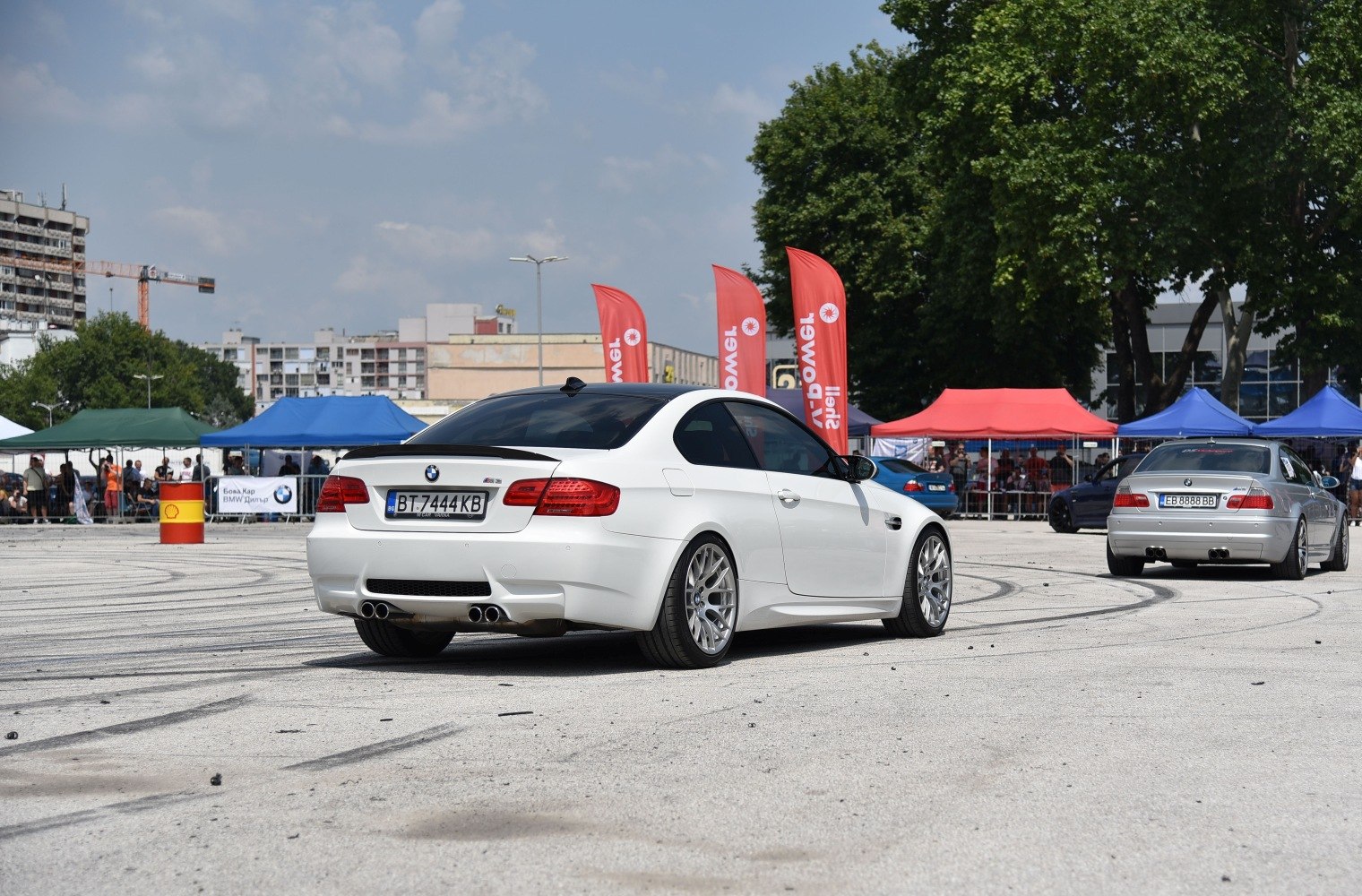 Rear view of an M3 Coupe with quad exhaust and alloy wheels.