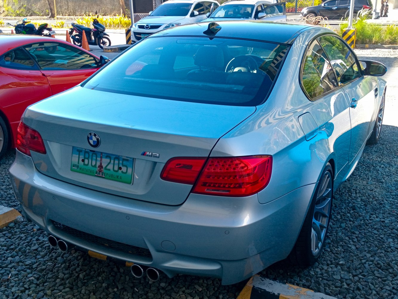 Silver coupe rear with quad exhaust and facelift taillights