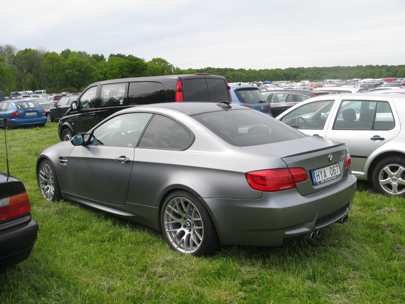 Sporty coupe rear view with quad exhausts and alloy wheels