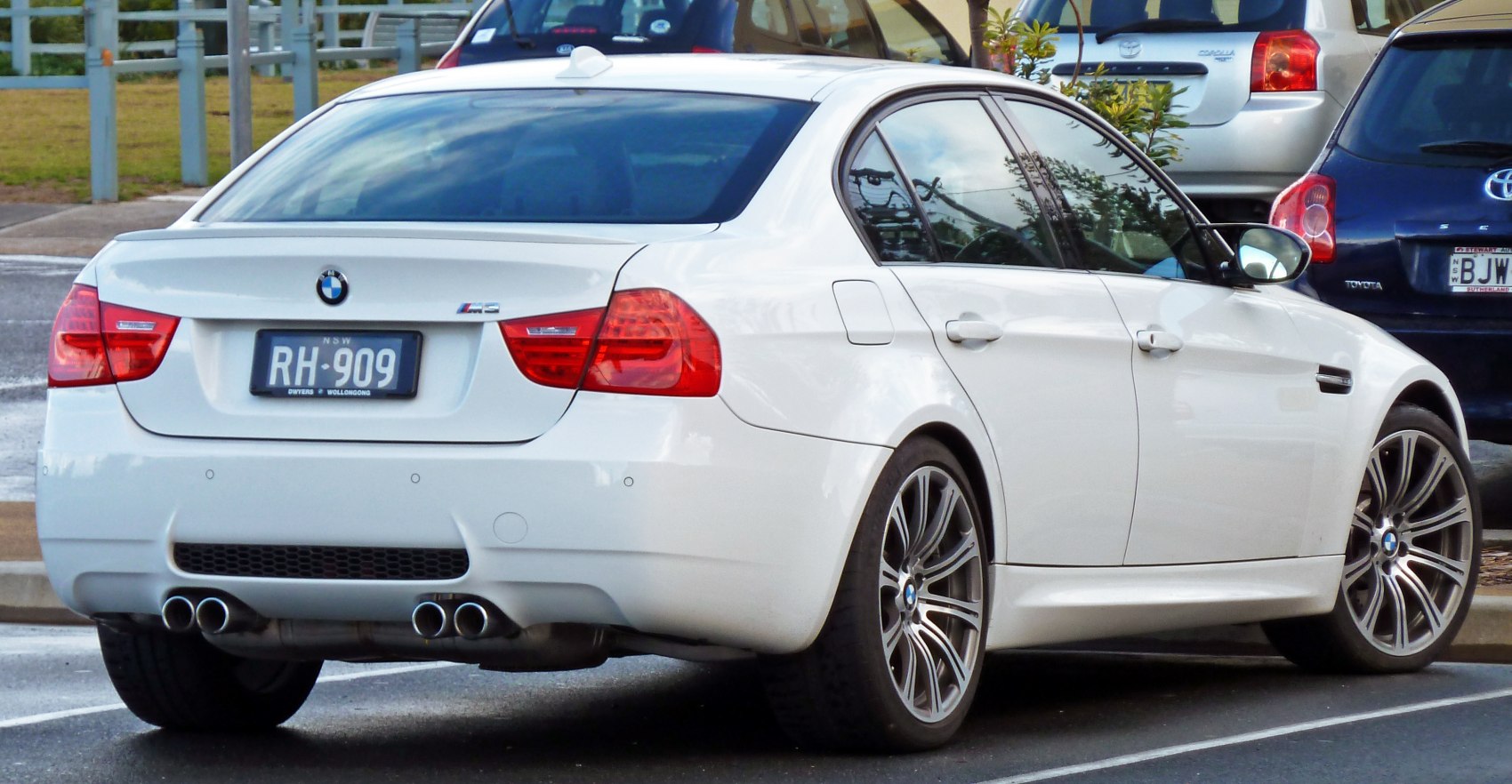 Rear view with quad exhaust and alloy wheels