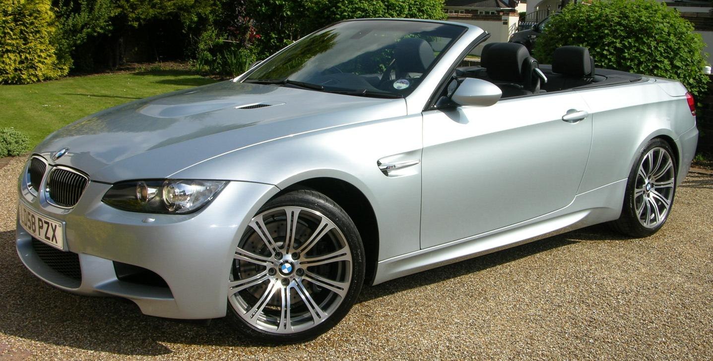 Silver convertible with detailed wheels and open roof