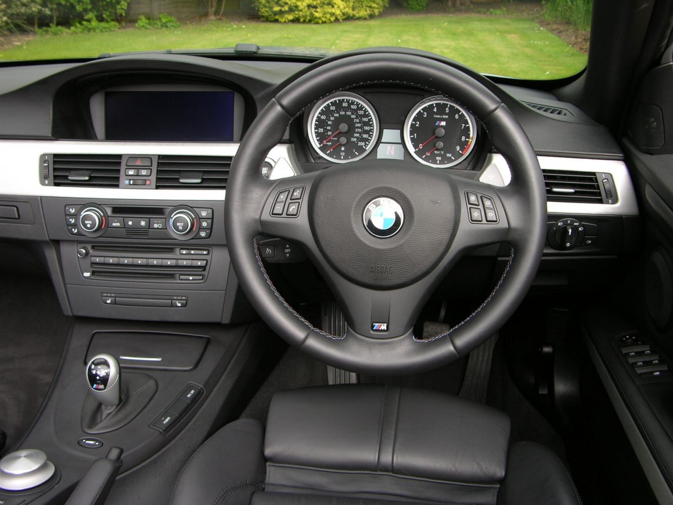 Steering wheel and dashboard of a luxury sports car interior