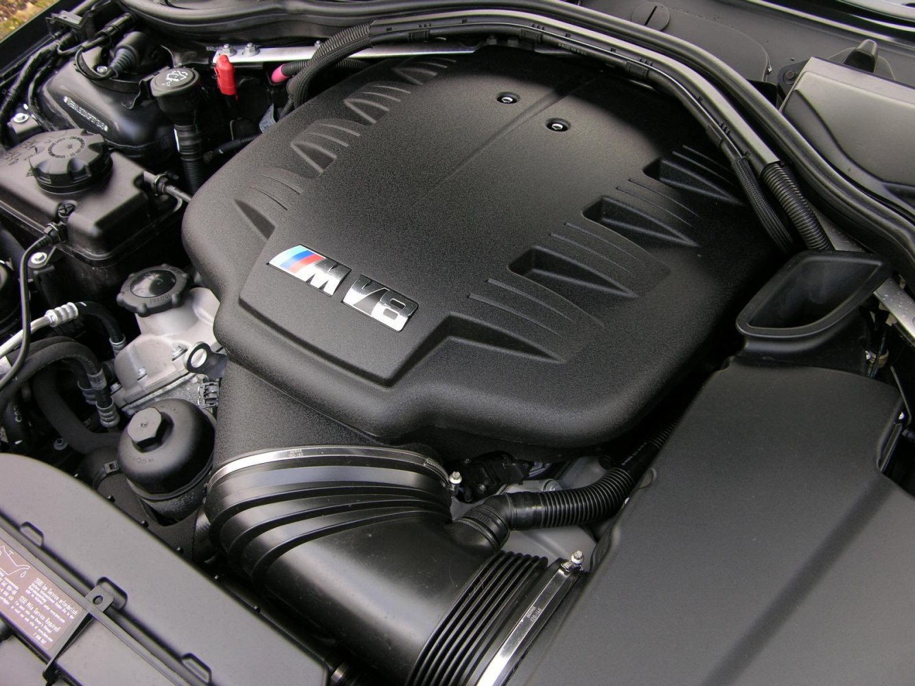 Close-up of M V8 engine with detailed engine bay components