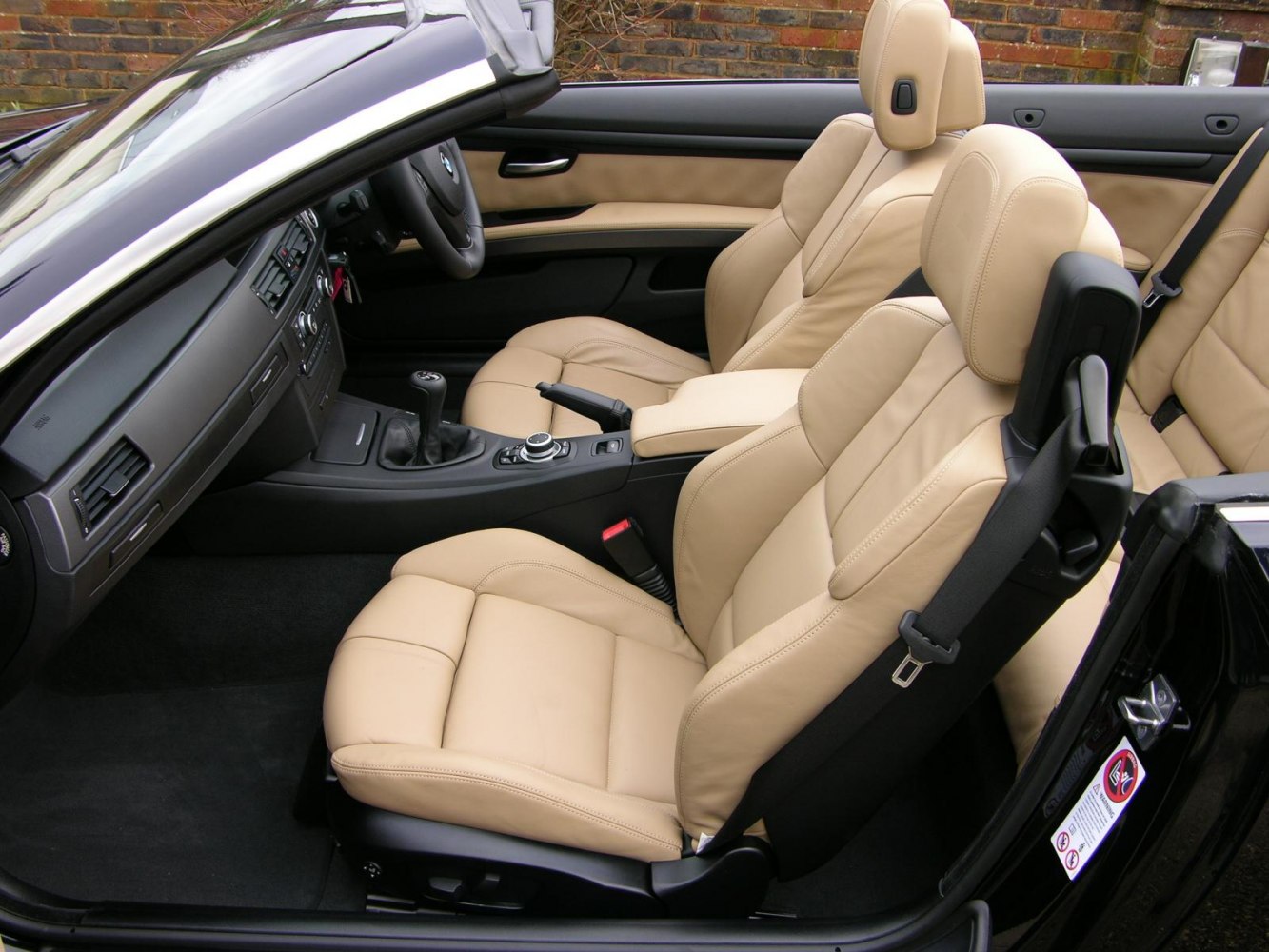 Beige leather sport seats and modern interior dashboard in convertible