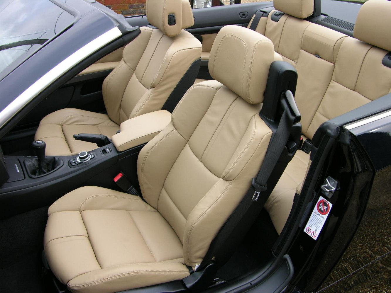 Beige leather sport seats and interior of convertible
