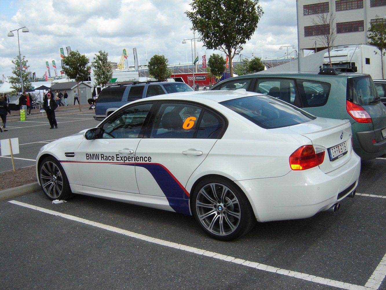 Sporty sedan with BMW Race Experience decals and alloy wheels