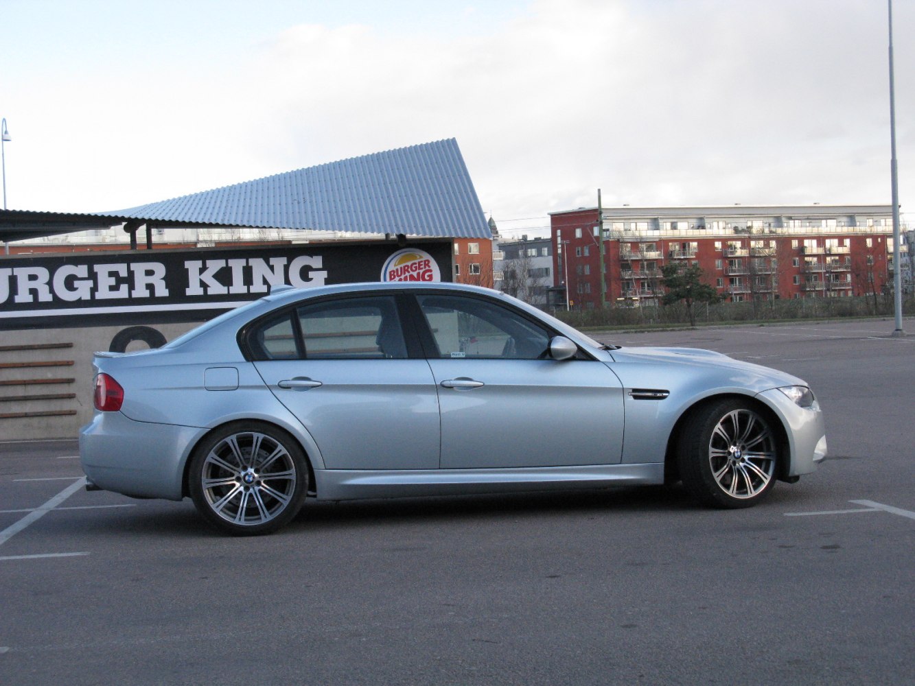 Silver sedan side profile with alloy wheels