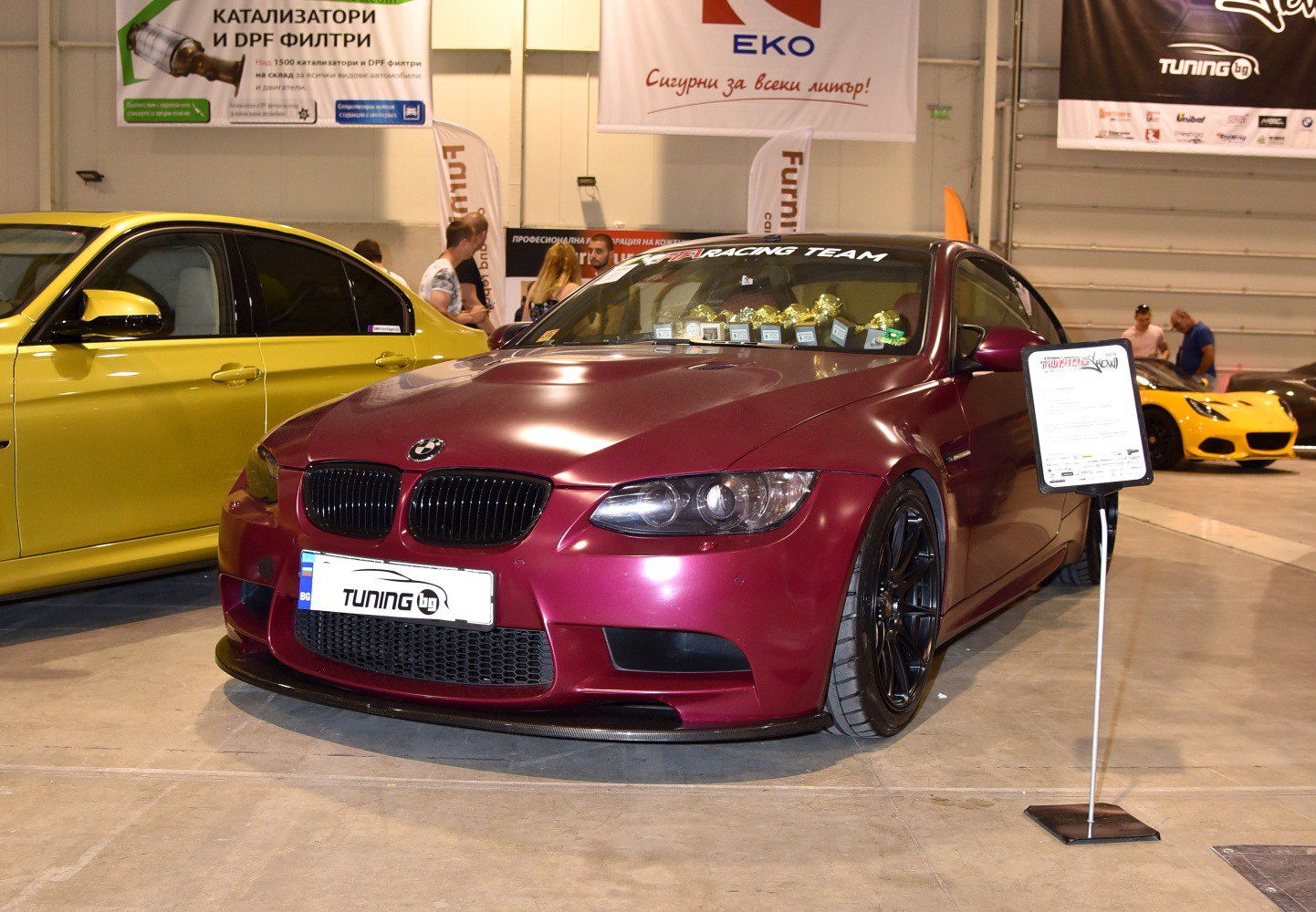 Matte finish coupe with black wheels and front splitter