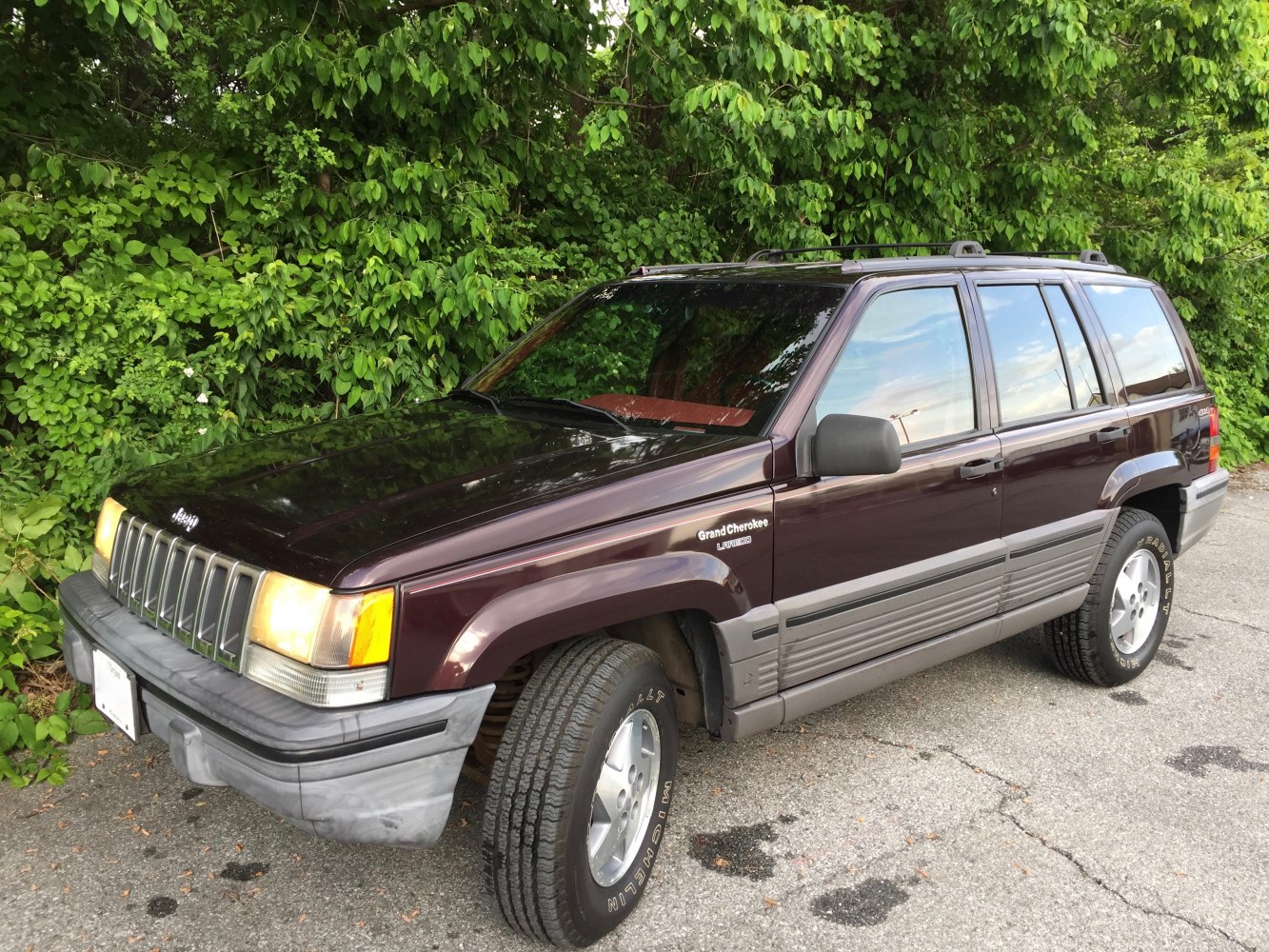 Boxy vintage SUV with rugged grille and large off-road tires
