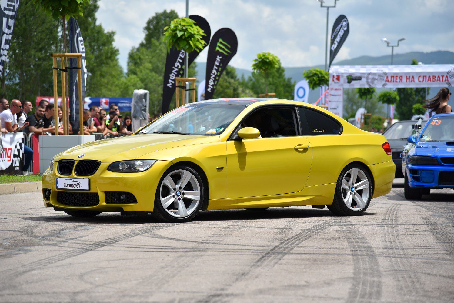 Yellow sports coupe with sporty alloy wheels and distinct headlights