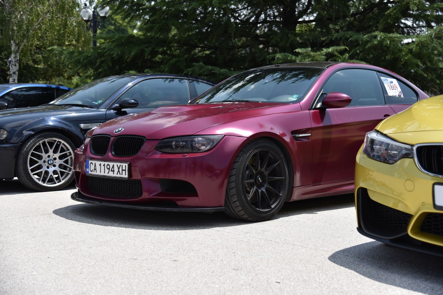 BMW coupe with black wheels and front splitter