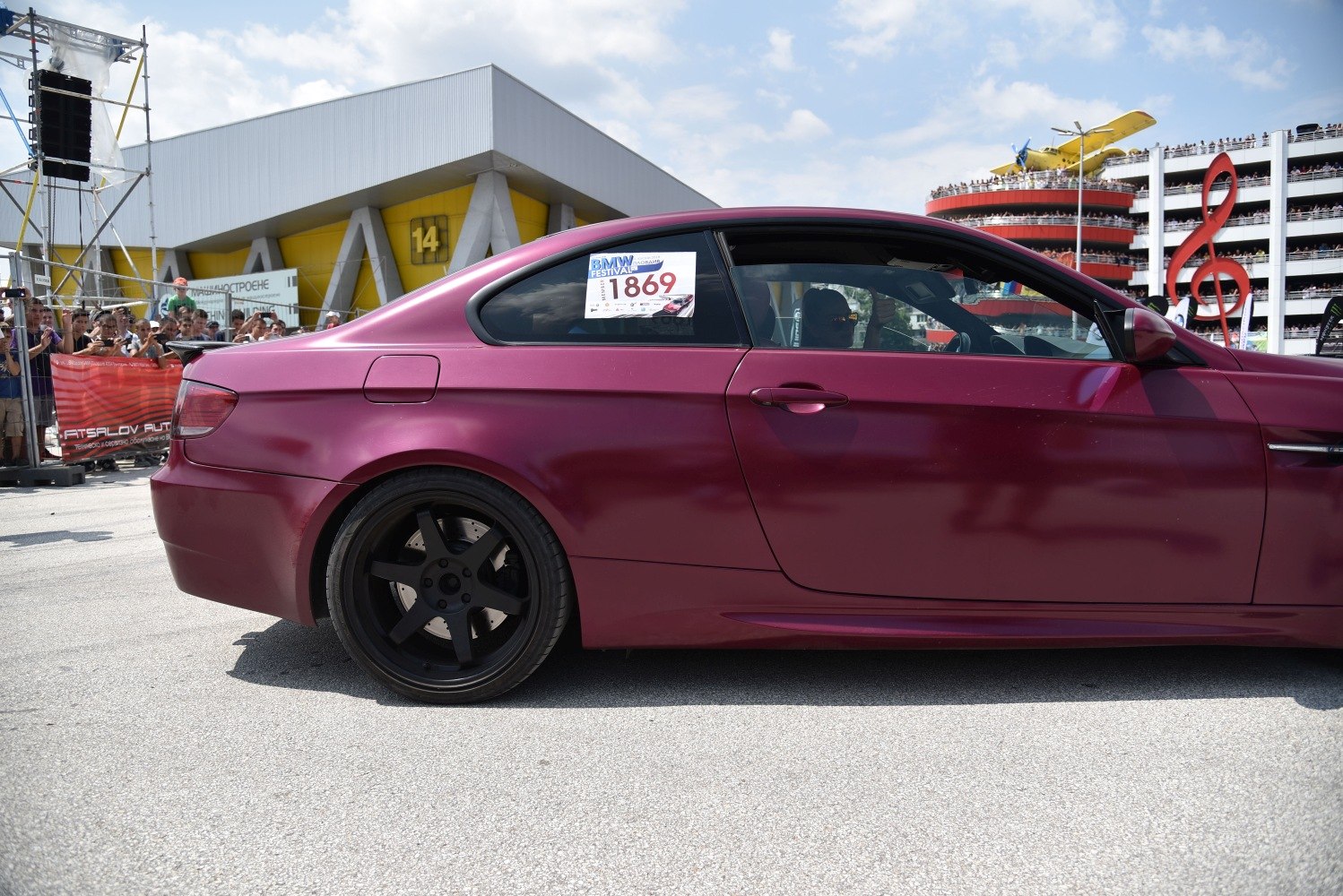 Matte purple coupe with matte black five-spoke wheels side view