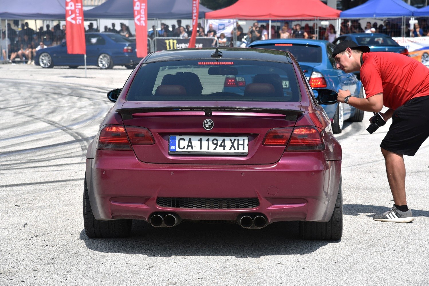 Sport coupe rear with quad exhaust and spoiler