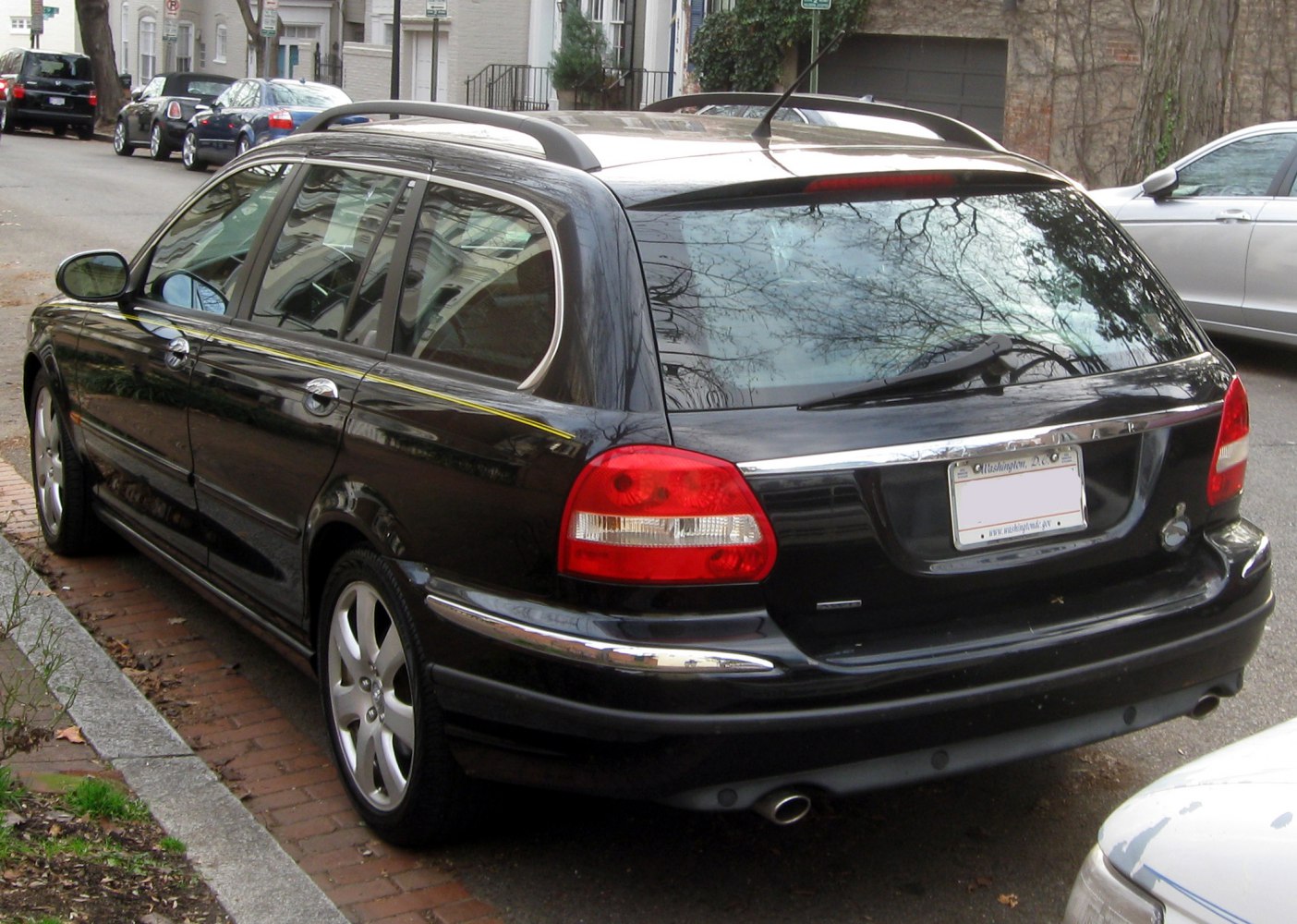 Rear view of an estate with roof rails and dual exhausts.
