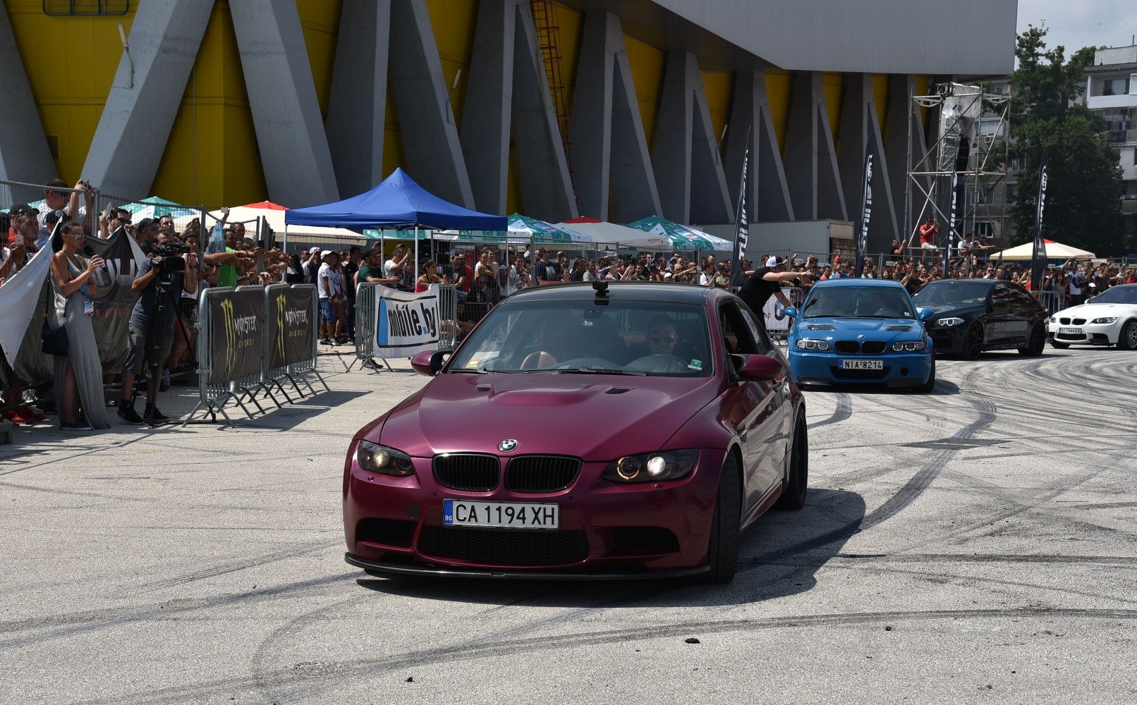 Front view of a sporty coupe in a motorsport event