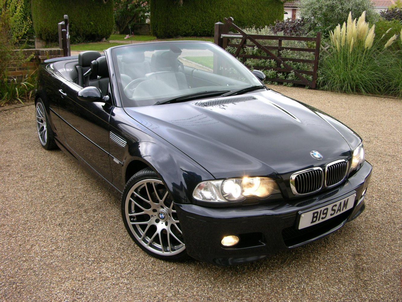 Front angled view of convertible with headlights and alloy wheels