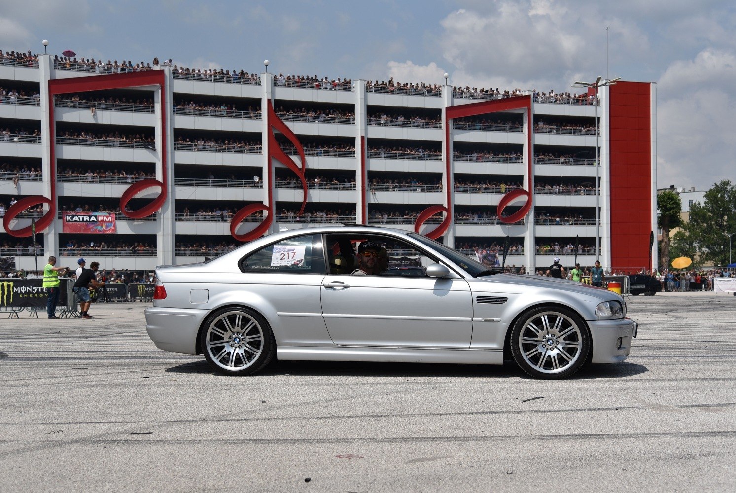 Silver two-door coupe with prominent alloy wheels