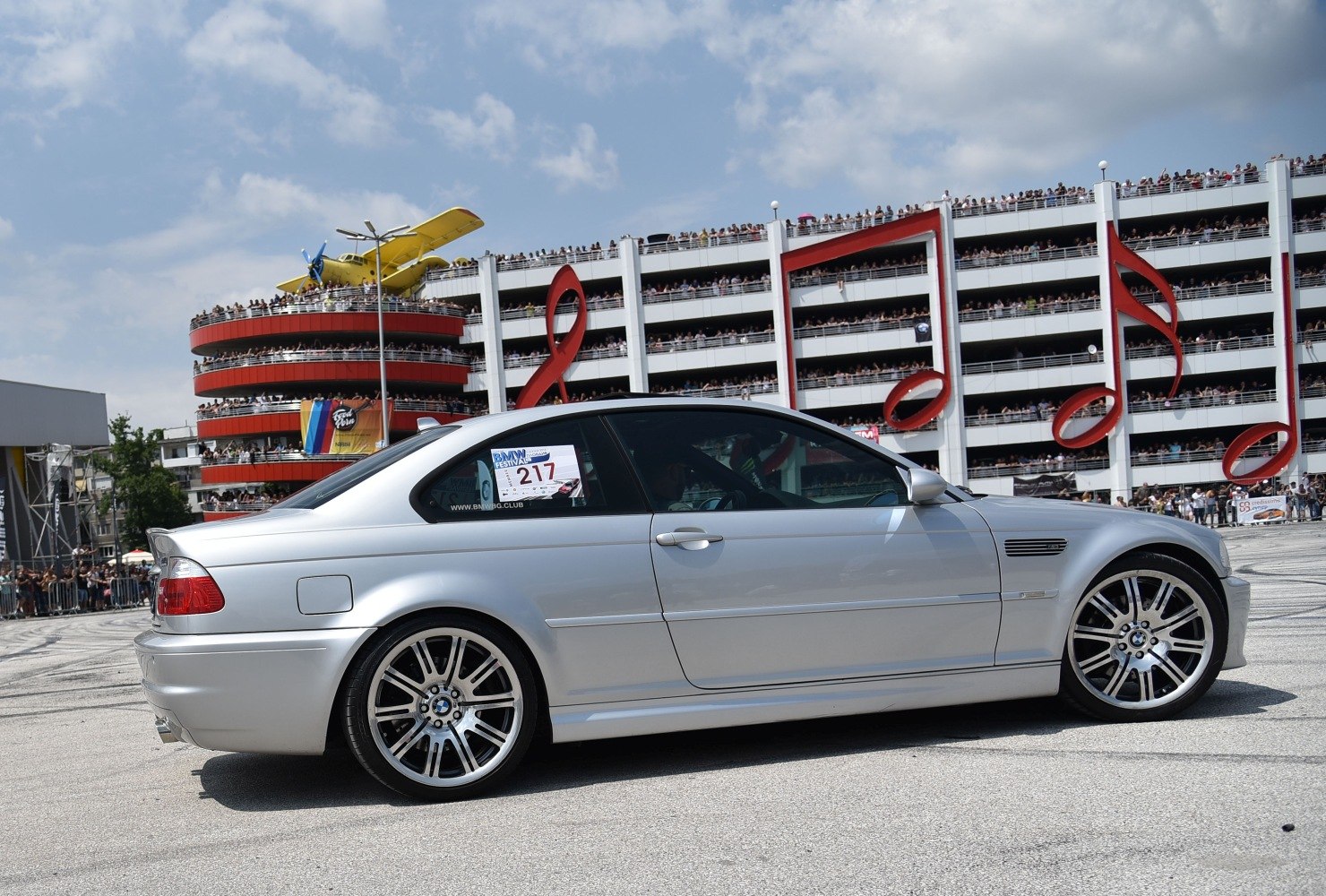 Silver coupe side profile with multi-spoke alloy wheels