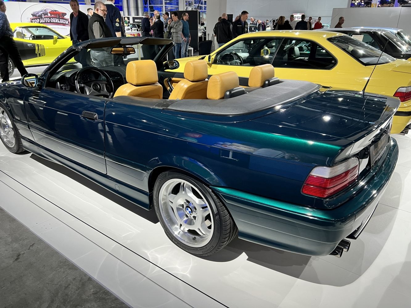 Sporty convertible with tan leather seats and dual exhaust