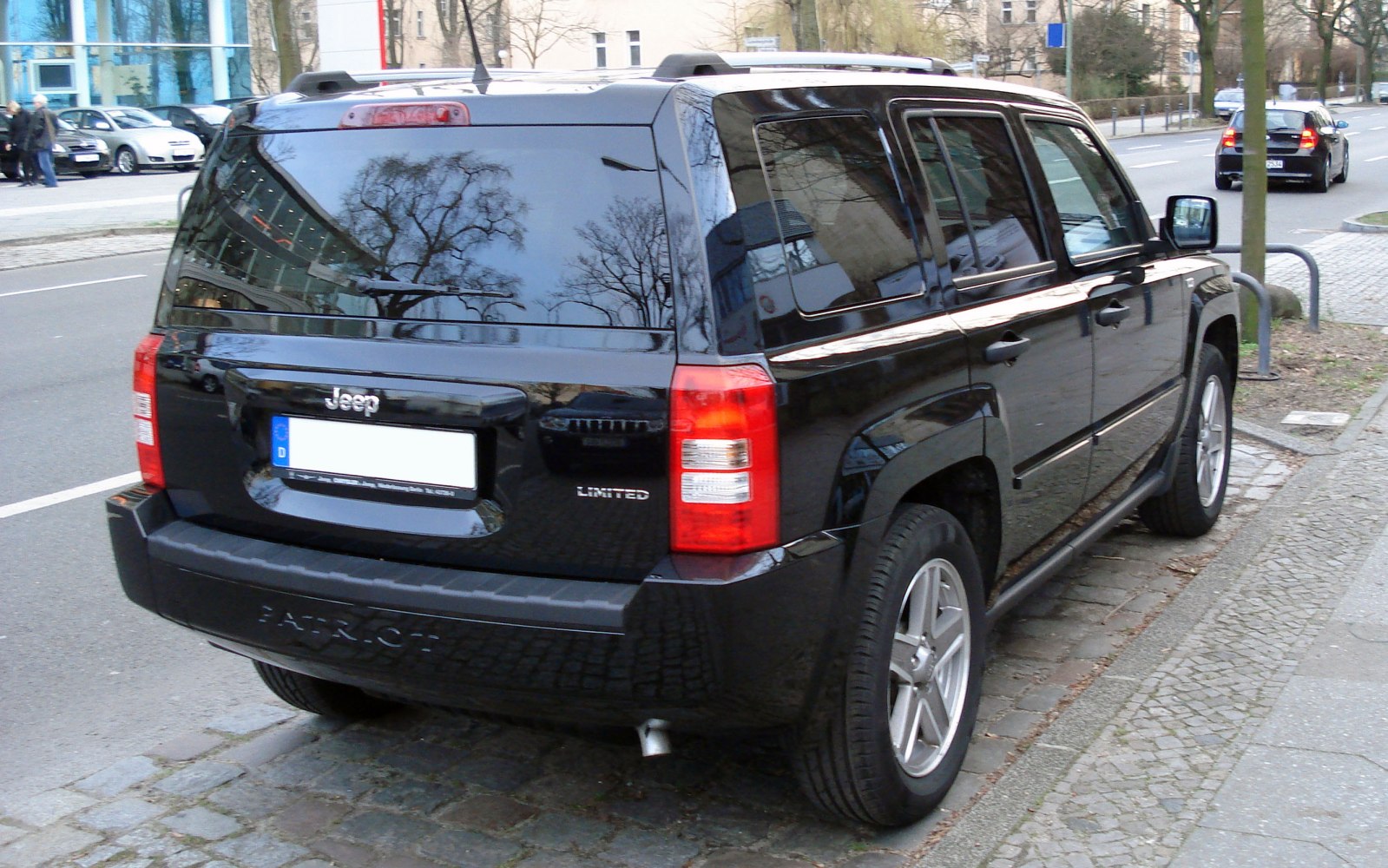 Rear view of an SUV with tinted windows and prominent tail lights