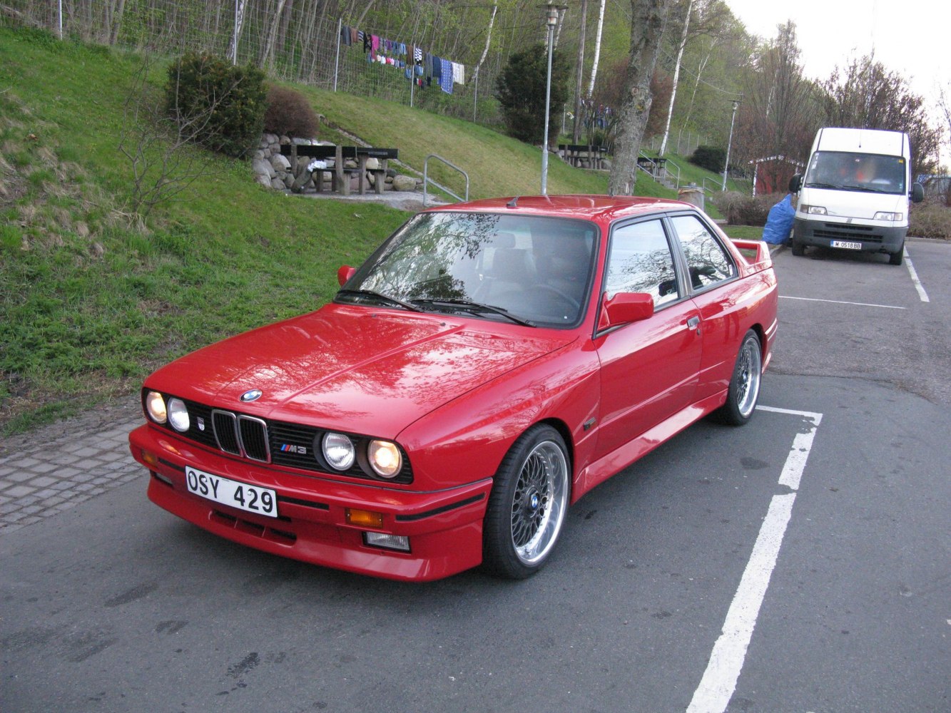 Red sports coupe with iconic front grille and alloy wheels