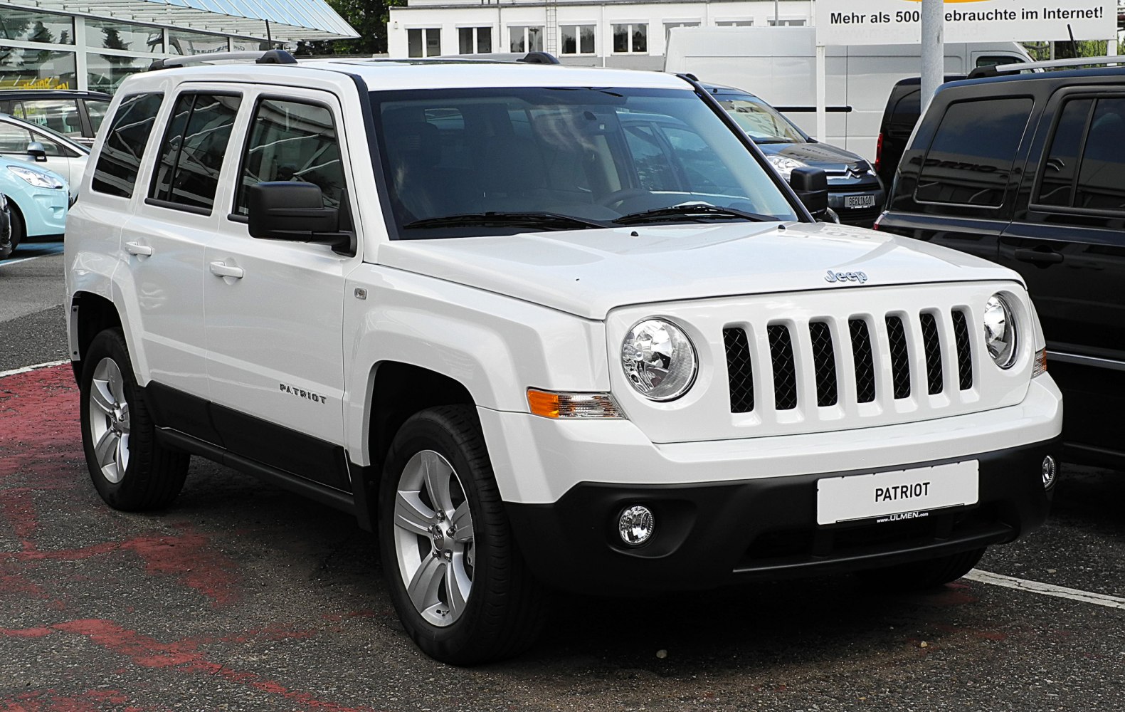 White SUV front view with classic grille and round headlights