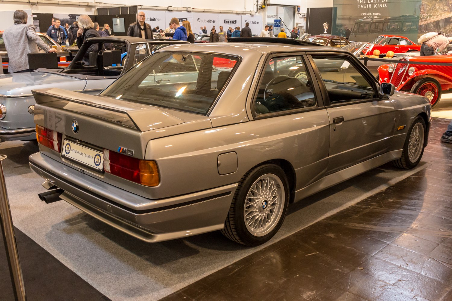 Rear side view of classic coupe with aero spoiler and alloy wheels
