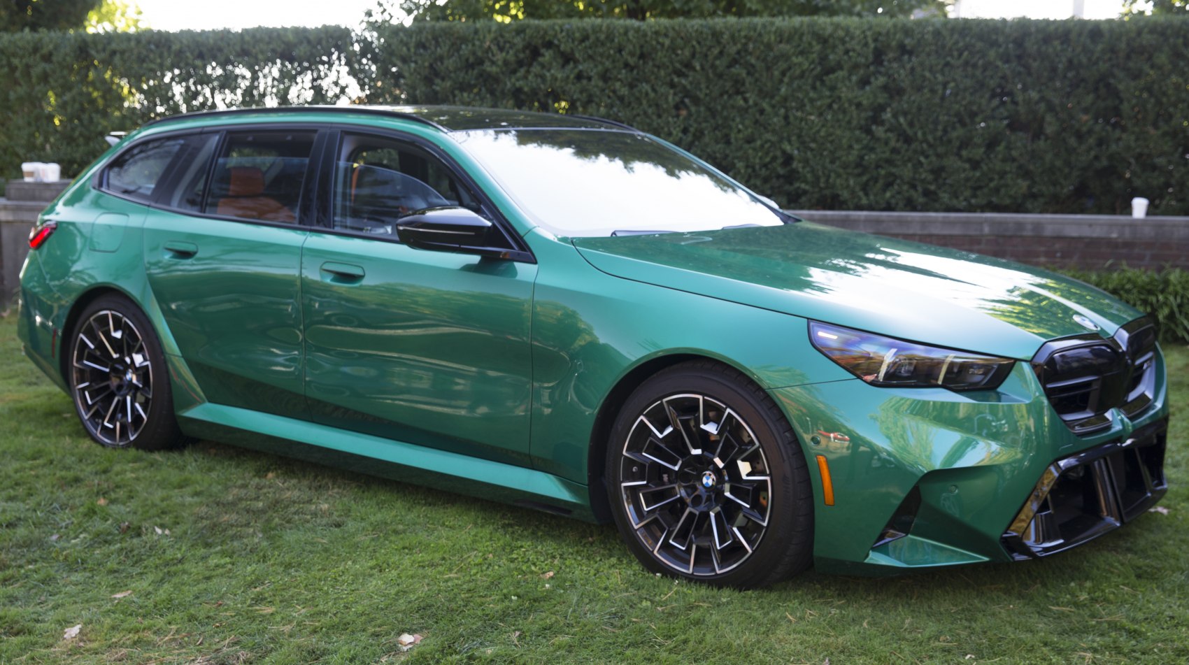 Green station wagon with sharp front design and sporty multi-spoke alloy wheels
