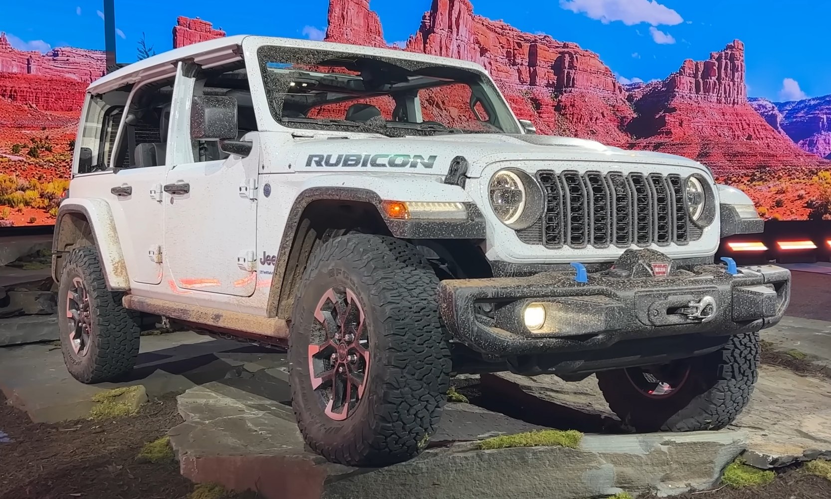 Rugged off-road SUV with large tires and seven-slot front grille