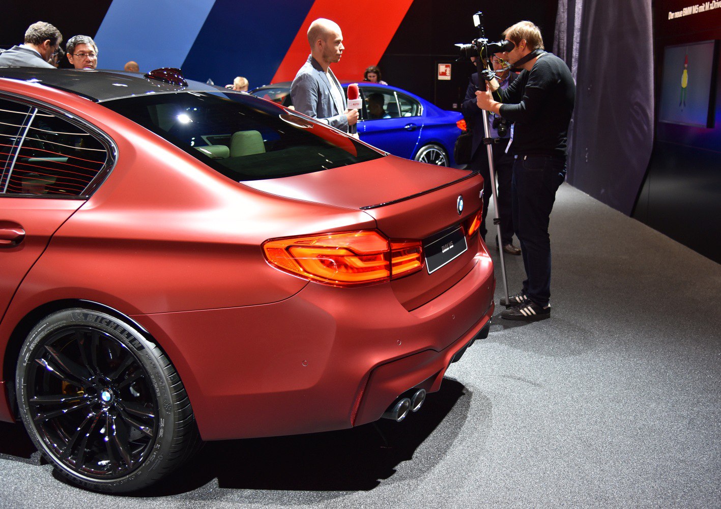 Sporty rear design with quad exhaust tips and black wheels