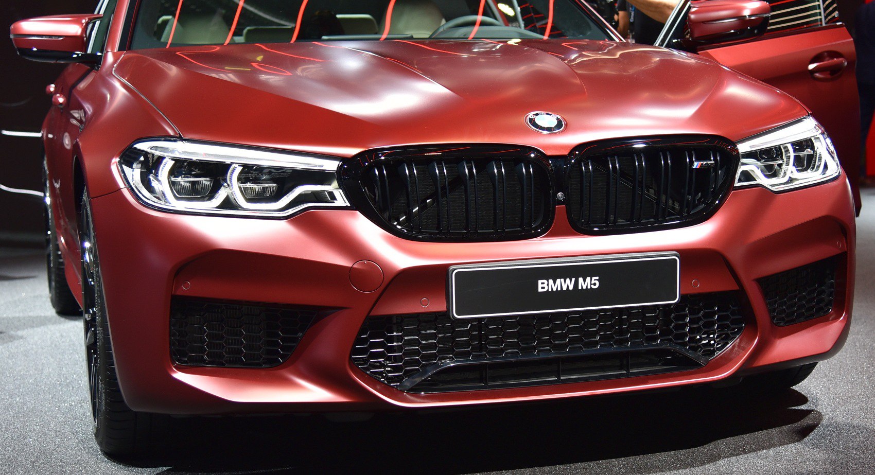 Close-up of aggressive front grille and LED headlights