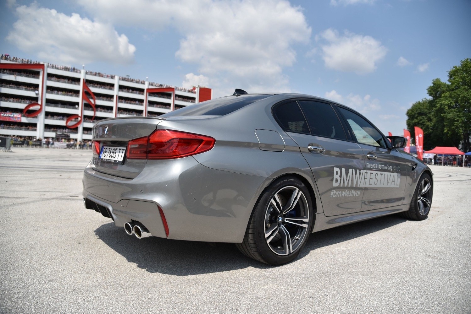 Rear side view with quad exhaust and alloy wheels
