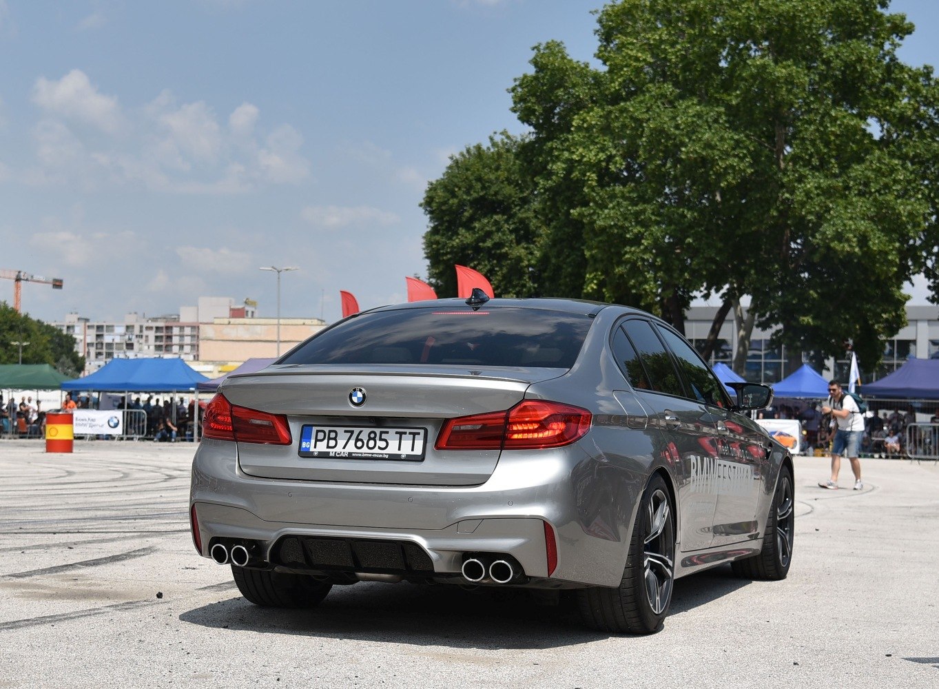 Sport sedan rear with quad exhaust tips and rear spoiler