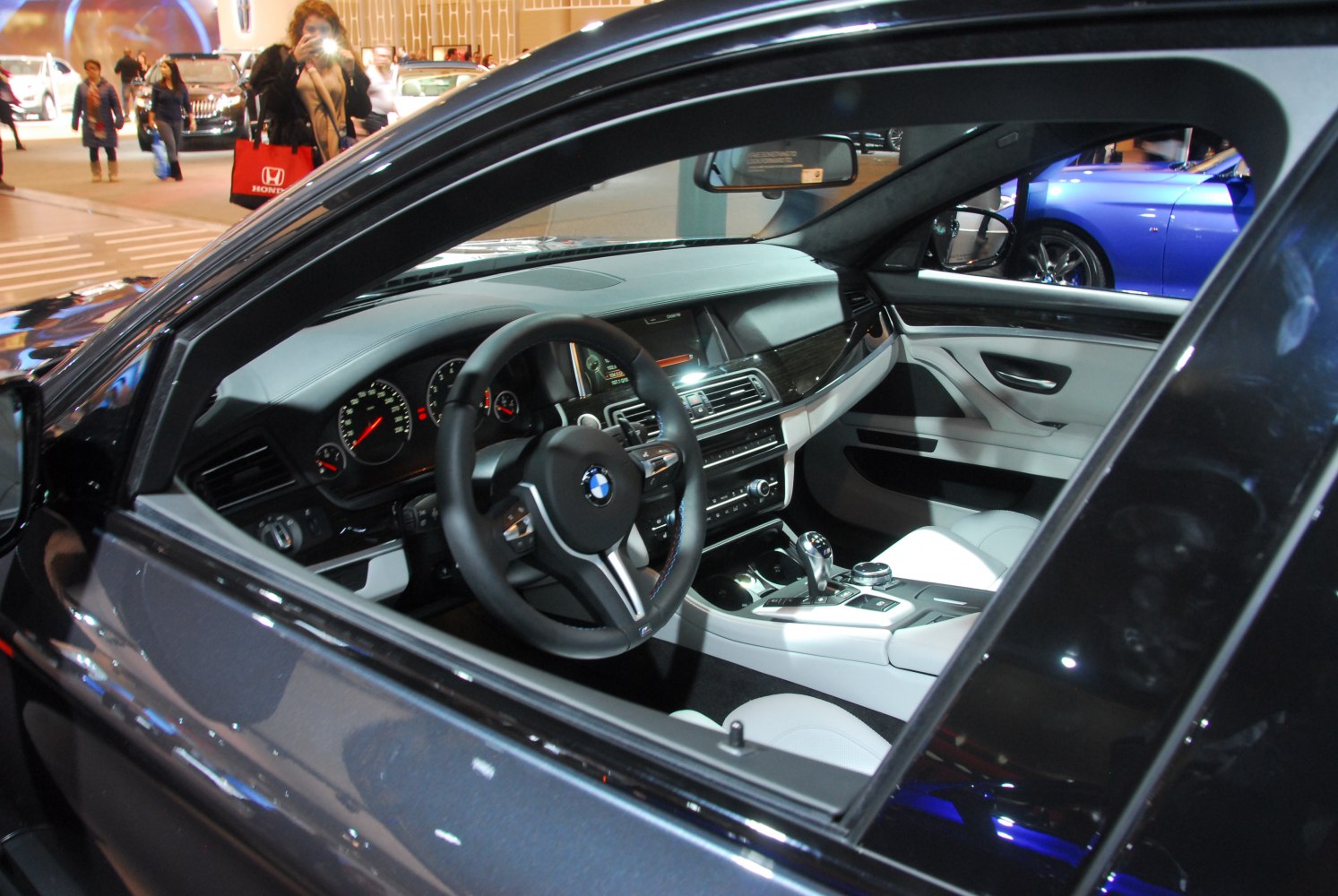 Dashboard and steering wheel view inside a modern luxury car interior