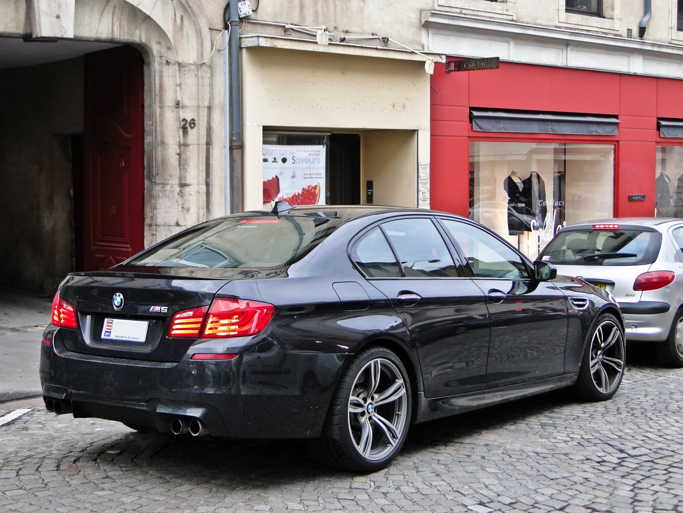Rear side view with quad exhaust and alloy wheels