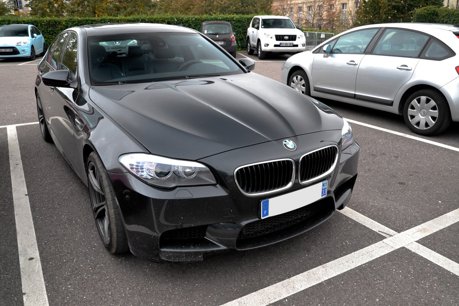 Front view of a sporty sedan with kidney grille and detailed headlights