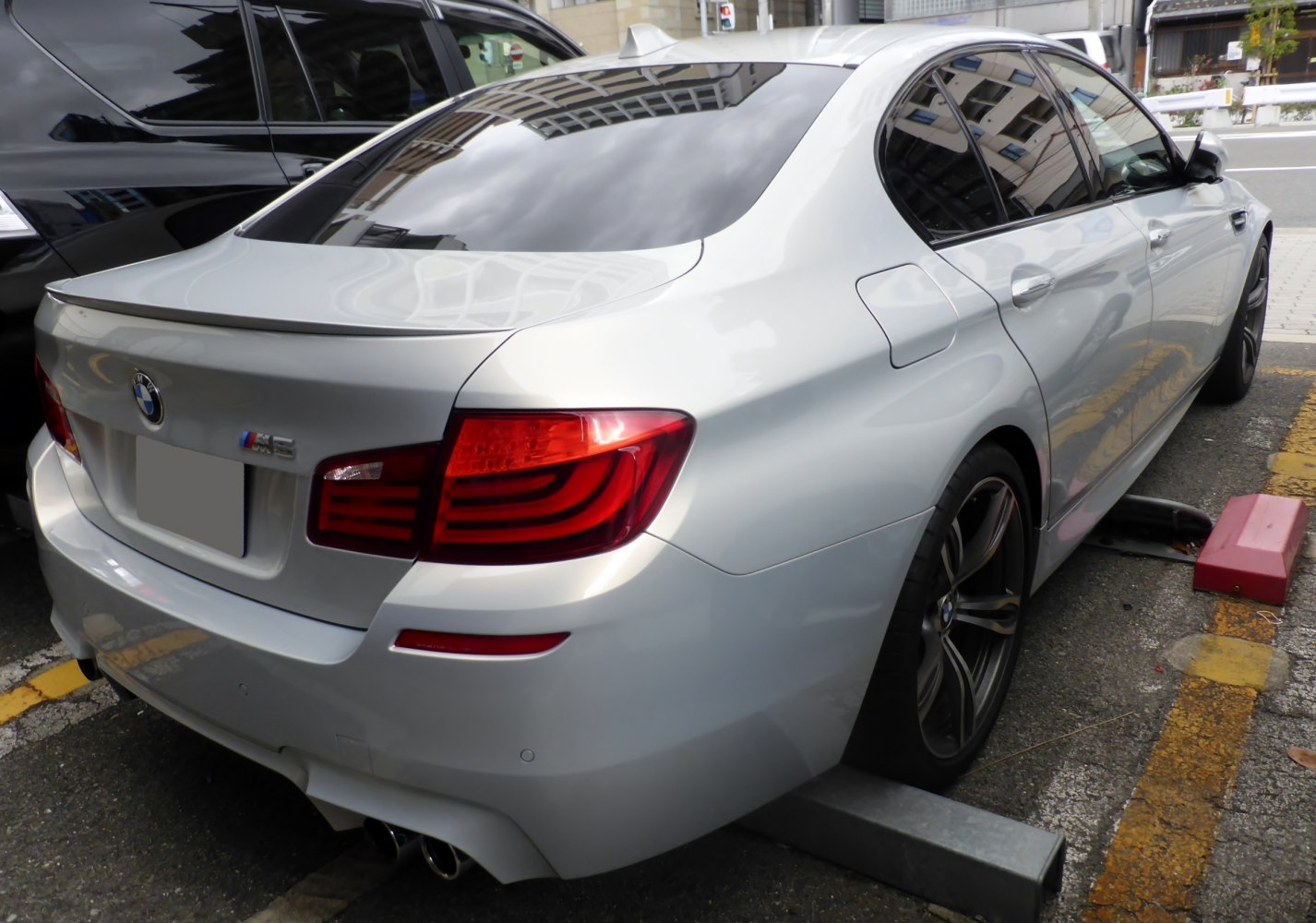Rear and side view with taillights and quad exhaust