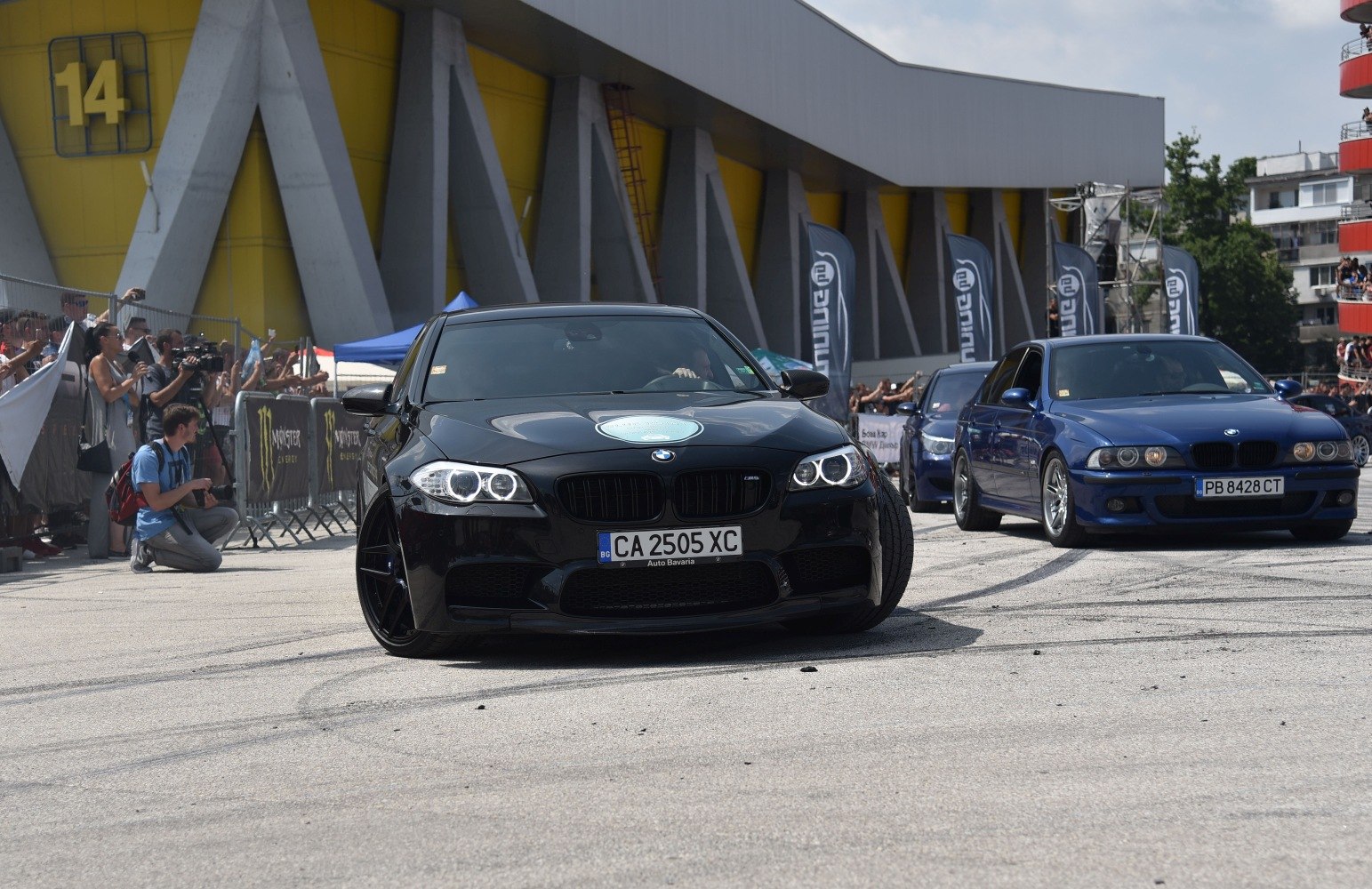 Black BMW front with angel eyes headlights and aggressive grille