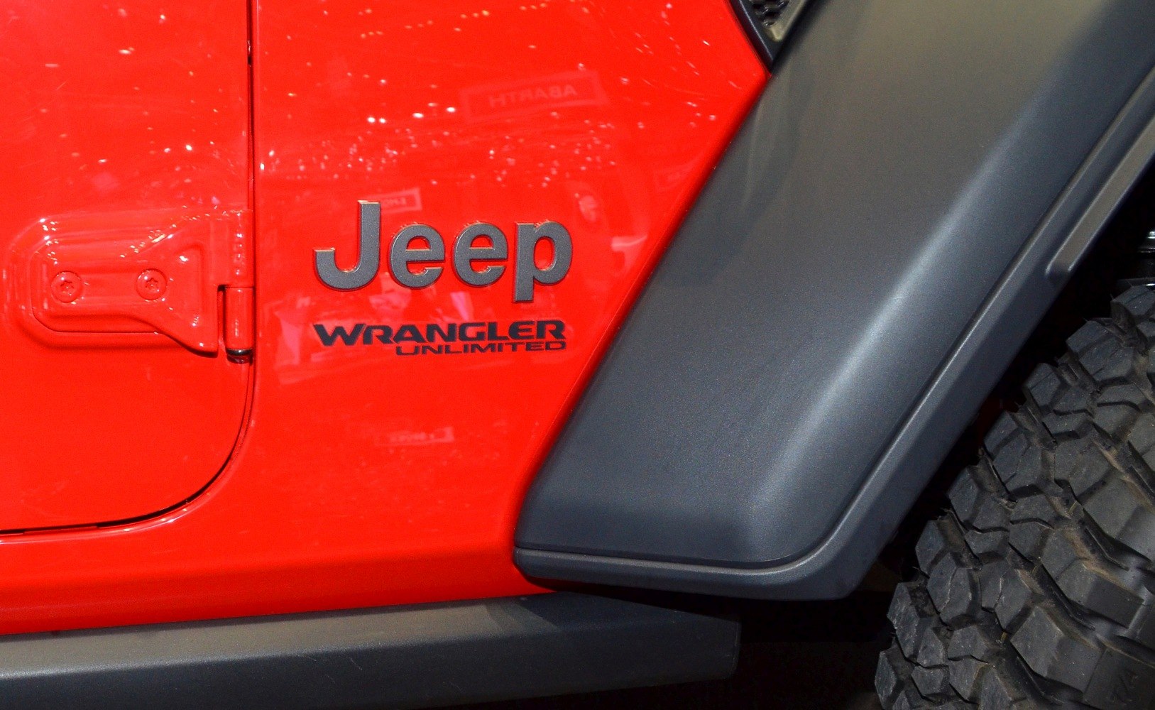 Jeep Wrangler Unlimited side emblem with rugged fender and off-road tire