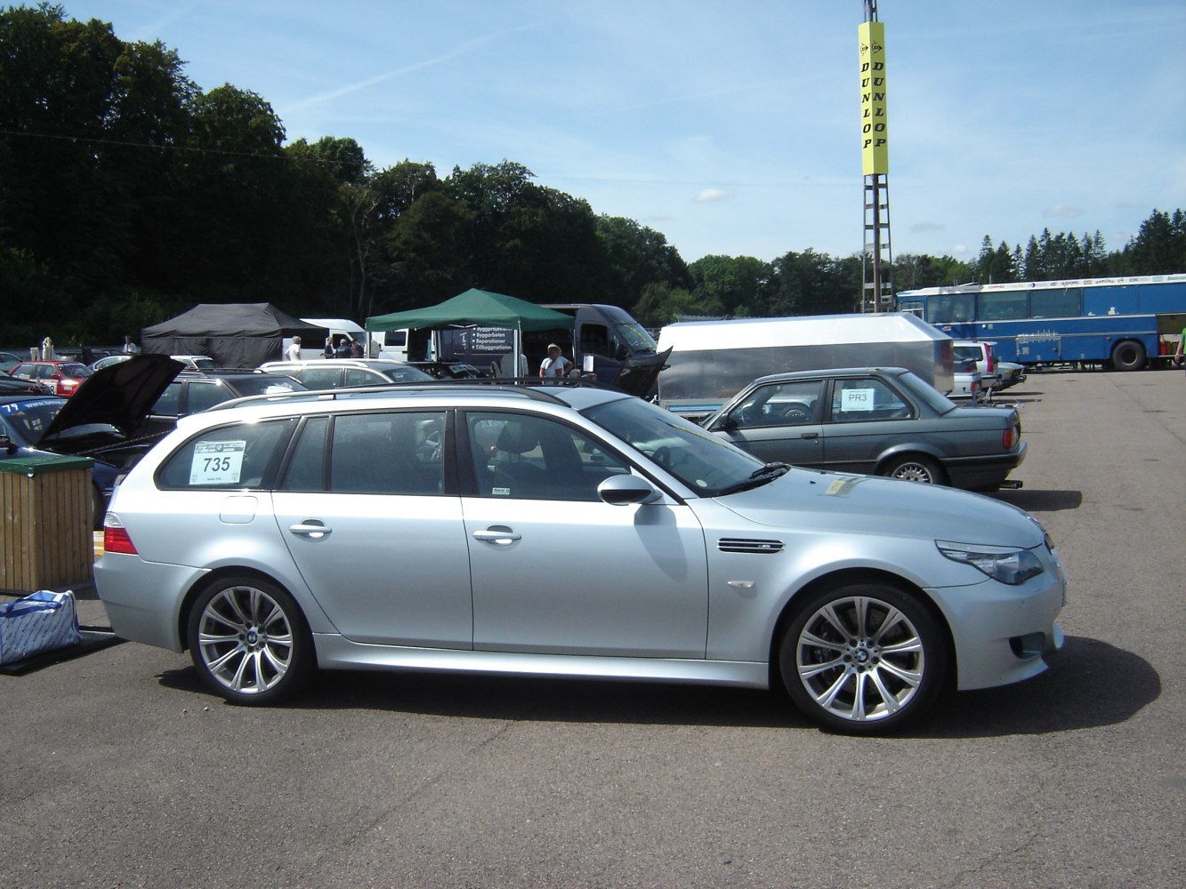 Silver sporty wagon with alloy wheels in outdoors